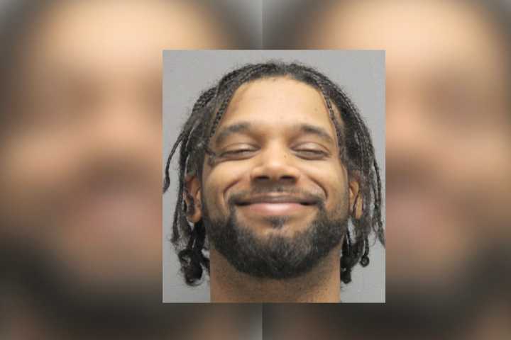 Smiling Suspect Busted For Brandishing Handgun During Domestic Dispute In PWC, Police Say