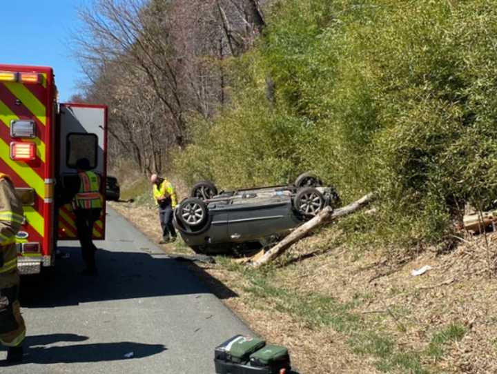 The vehicle reportedly overturned and struck a tree.