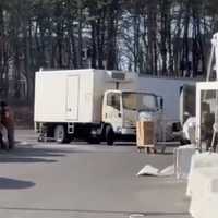 <p>A box truck driver in a Lakewood supermarket parking lot.  (The Lakewood Scoop)</p>