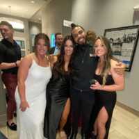 <p>Dom Travis-Bey with friends after bartending a wedding.</p>