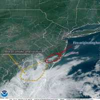 <p>The area circled from this satellite view shows high concentrations of smoke due to a wildfire at Bass River State Forest, according to the National Weather Service.</p>