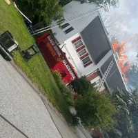 <p>Flames ripped through the roof of a home on Willow Road in Milford on Monday, June 26</p>