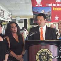 <p>Paterson Mayor Andre Sayegh flanked by the Doukas family, owners of Nicholas Diner.</p>