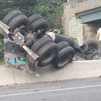 <p>An overturned tractor trailer closed Route 17 in Mahwah Friday morning, Sept. 8.</p>