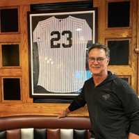 <p>Don Mattingly with his jersey at W&#x27;s Village Grille.</p>