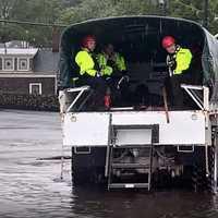 <p>A driver and passenger in a partially submerged SUV were rescued in Hawthorne.</p>