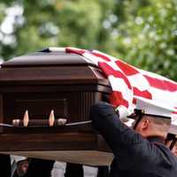 <p>Marines from the Marine Barracks, Washington, D.C. (8th and I) conduct military funeral honors for U.S. Marine Corps Cpl. Spencer Collart in Section 52 of Arlington National Cemetery, Arlington, Va., Sept. 25, 2023.</p>