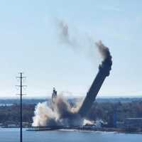 <p>The smokestack falling at the B.L. England Generating Station in Upper Township. The cooling tower, at the bottom left of the photo, was imploded in 2022.
  
</p>