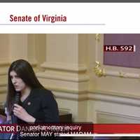 <p>Senator Danica Roem speaks to VA Lt. Gov. Earle-Sears Monday, Feb. 26.</p>