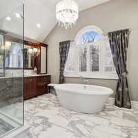 <p>The primary suite's en-suite bath, one of eight bathrooms in the $3.45 million home for sale on Audubon Drive in Princeton.</p>