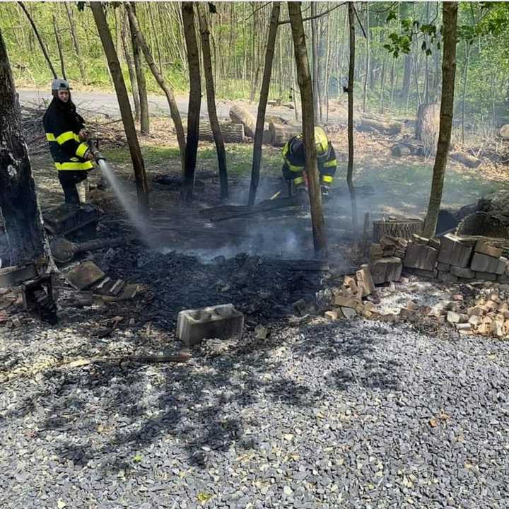 Perkasie firefighters doused a brushed fire after the flames were spotted by a resident in the neighborhood Wednesday.