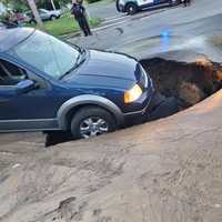 <p>This photo was taken of the sinkhole in Chicopee earlier today, July 15.</p>