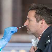 <p>(Photo illustration) Rapid response COVID-19 tests typically swab a person&#x27;s nose or throat to collect a sample.</p>