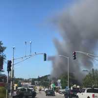 <p>Screengrab from Adventure Awaits, Youtube, shows the start of a fire on Main Street in Worcester, Aug. 18.</p>