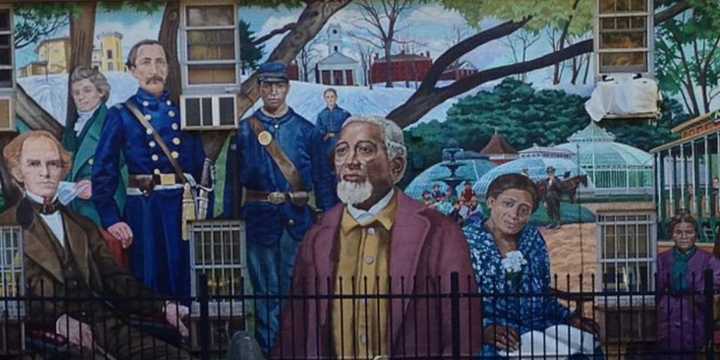 A Western Massachusetts town known for its out-of-the-box programs and solutions to local and national issues is eyeing the creation of an art tax. Pictured here is a mural in Amherst.