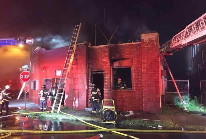 Police have arrested a man accused of setting a vacant Springfield building on fire.