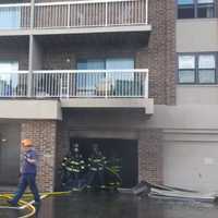 <p>Firefighters at a smoky blaze Sept. 30.</p>