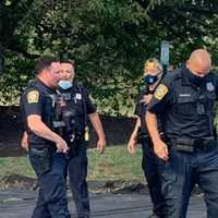 <p>Police officers evacuated residents from a building on fire Sept. 30.</p>