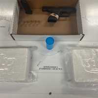 <p>Suspected cocaine (2 kilos) and a Glock seized by Massachusetts State Police on Nov. 8.</p>