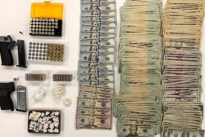 In Routine Check, Parole Officer Allegedly Finds Drugs, Cash, Guns