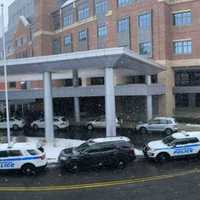 <p>Police cruisers line up to bring an officer home</p>