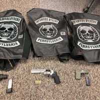 <p>Some of the weapons and Infamous Ryders Motorcycle Gang jackets that were seized by the NY state police.</p>