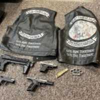 <p>Some of the weapons and La Familia Motorcycle Gang jackets that were seized by the NY state police.</p>