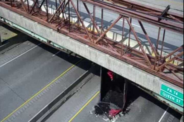 The truck stuck on the bridge along I-83.