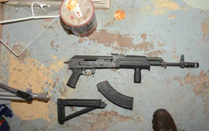 Federal agents said they seized large amounts of cash, drugs, and this loaded AK-47 47 assault rifle from Djuna Goncalves during his arrest.