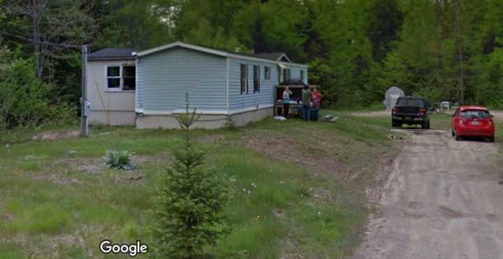 Deputies found the body of Shoeb Mohamed Adan, of Springfield, and a 16-year-old boy from Lewiston, Maine, inside this home at 205 Tripp Lake Road in Poland, Maine, last week. Investigators arrested a 46-year-old and charged him with the killings.