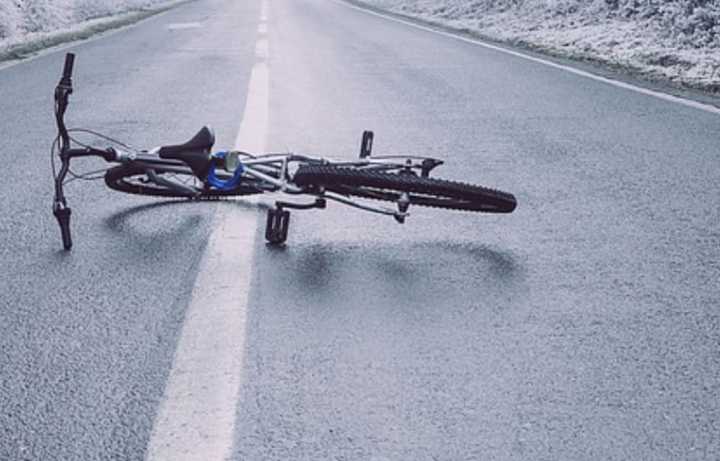 A bicycle in the middle of the road.