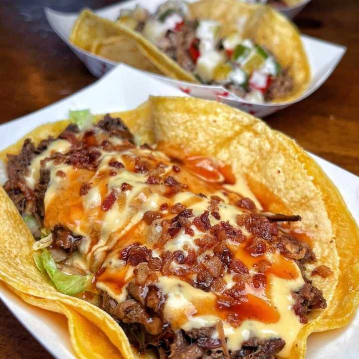 Smōk-Haus, voted Best Taco on Long Island, offers unique flavors, such as the Americano Taco (above, front).