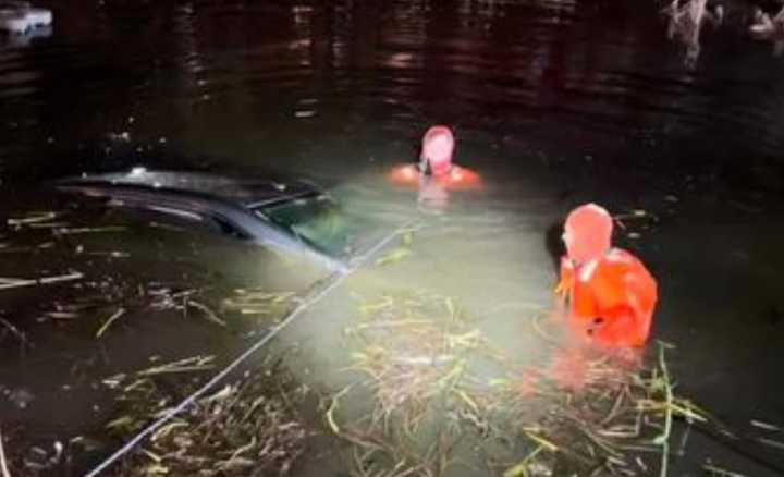 Newly released footage from the Pequannock Police Department shows the “truly amazing rescue” of a driver and passenger after their car plunged into a local pond, leaving the pair neck-deep in frozen waters.