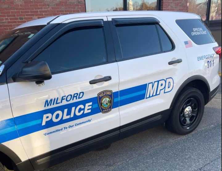 Milford police evacuated Stacy Middle School in Milford Wednesday afternoon after an &quot;unknown substance&quot; was sprayed there, officials said.