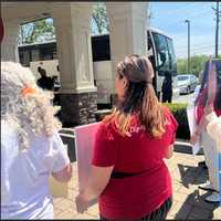 <p>The first bus of migrants arrived at the hotel.</p>