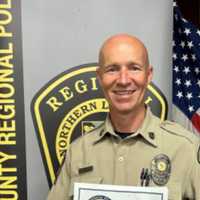 <p>Officer Derek Oleszczuk with his award.</p>