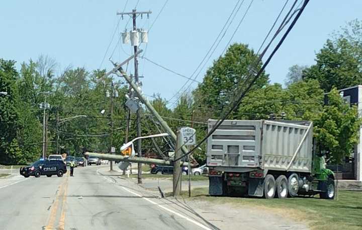 A dump truck crashed and took down a utility pole, closing a portion of Route 23 in Sussex County during the afternoon on Thursday, May 18, police said.