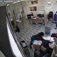 <p>The two suspects were captured on camera punching each employee, throwing a chair at the female employee&#x27;s head, and even pulling out and displaying a black gun.</p>