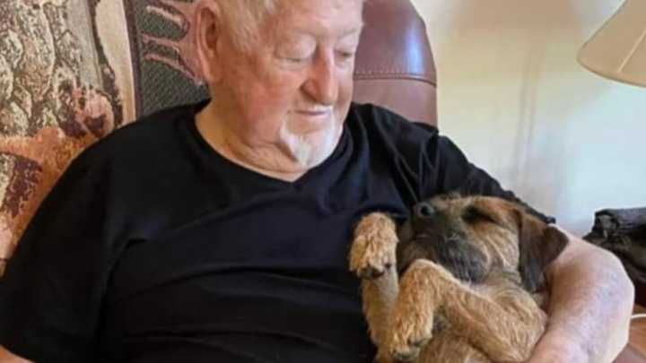 Leo Lafreniere and his beloved dog Kate Murphy. Kate died from smoke inhalation after the fire and Leo buried her in the front yard of his Petersham home.