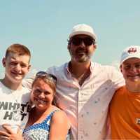 <p>Pete Simoulidis with his wife Heather and two sons.</p>