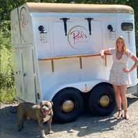 <p>Danielle Strang alongside Red&#x27;s Mobile Bar</p>