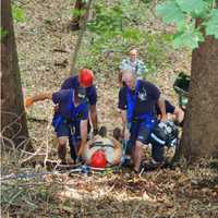 <p>Firefighters rescue the injured man.</p>