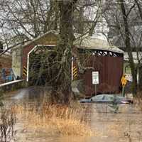 <p>The flooding at Zook's Mill Covered Bridge and a swept away sedan on Dec. 18, 2023.&nbsp;</p>