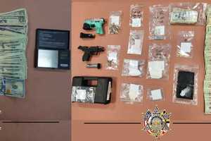 Stolen Guns, Drugs, Cash Seized During Two Searches In Maryland, Sheriff Says