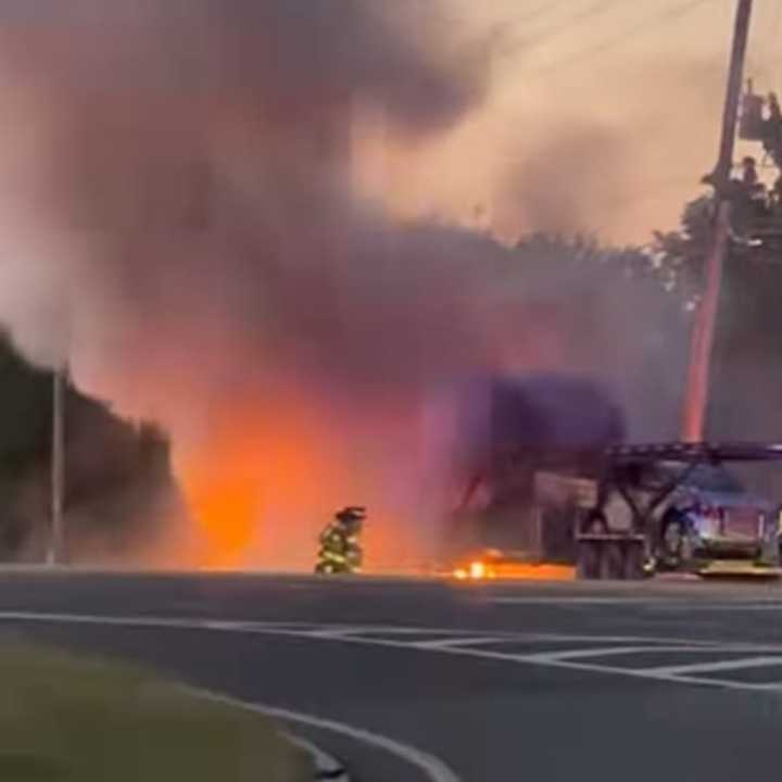 A tractor trailer was engulfed in flames.