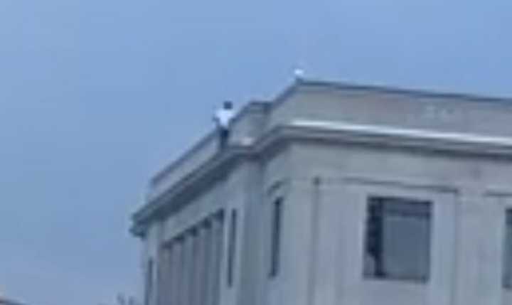 A man was climbed to the top of Linden&#x27;s city hall Monday and threatened to jump