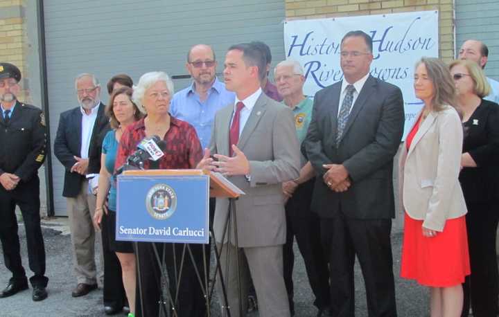 Assemblywoman Sandy Galef, front left, and state Sen. David Carlucci, front right, gather with local officials to announce funding for the Sing Sing Historic Prison Museum in Ossining.