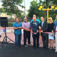 <p>Officials cut the ribbon on the new spray park</p>