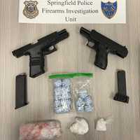 <p>Some of the guns and drugs Springfield police said they found in a home on Wilbraham Road last week. Officers arrested Robin Liberte and Julias Cruz in the raid, authorities said.</p>