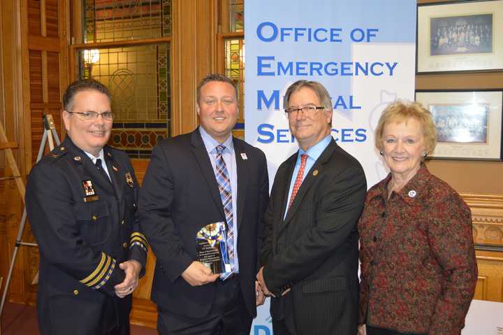 Rep. J.P. Sredzinski (second from left) was joined by (from left) Captain Bill Ackley, Stamford EMS, Monroe First Selectman Steve Vavrek, and Newtown First Selectman Pat Llodra at the ceremony.